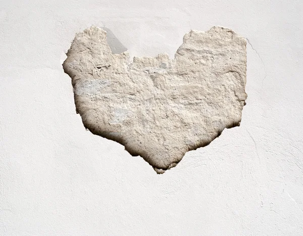 Stucwerk muur met hart vorm — Stockfoto