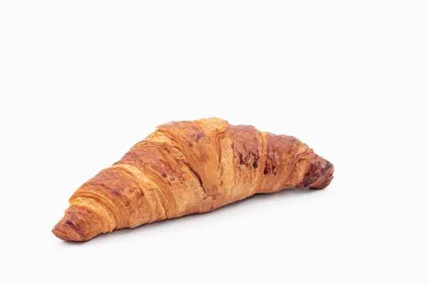 Frisch gebackenes Croissant auf hellem Hintergrund — Stockfoto