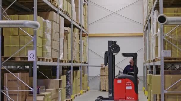 Male Worker Powered Industrial Forklift Truck Lifting Moving Boxes Warehouse — Stock Video