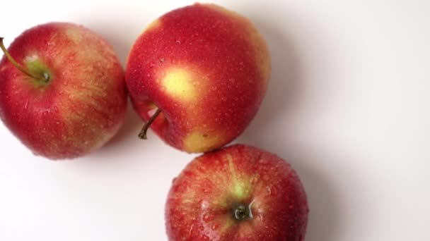 Beautiful View Three Wet Red Apples Rotating White Background — Stock Video