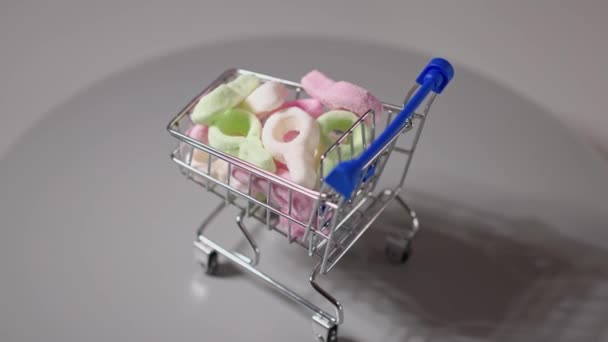 Close View Colorful Marmalade Trolley Isolated Unhealthy Food Concept — Stock Video