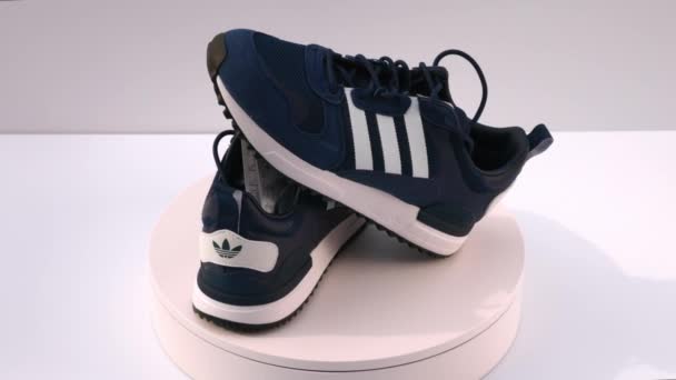 Close View Rotating Blue Adidas Sneakers Isolated Background Sweden Uppsala — Vídeos de Stock