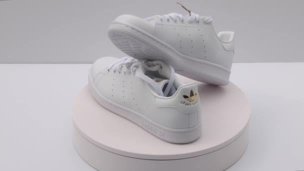 View Rotating White Adidas Sneakers Isolated Background Sweden — Stok video