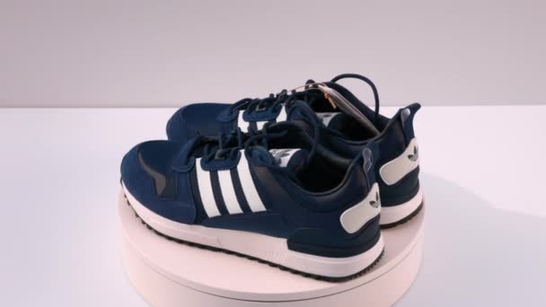 Close View Rotating Blue Adidas Sneakers Isolated Background Sweden Uppsala — Stock Video
