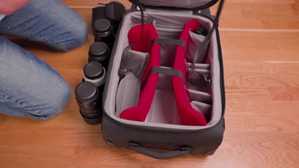 Close View Man Packing Canon Photographic Equipment Lenses Suitcase Tourist — Vídeos de Stock