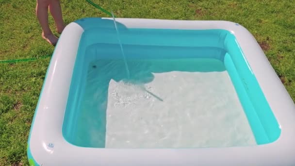 View Children Swimming Pool Being Filled Water Garden Hose Swimming — Video Stock