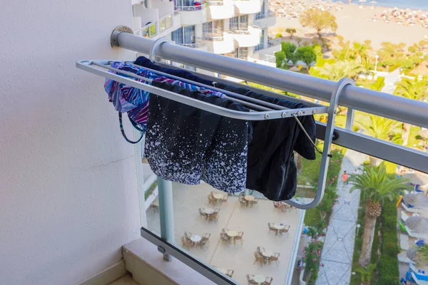 Close up view of clothes dryer on balcony of hotel room. Greece.