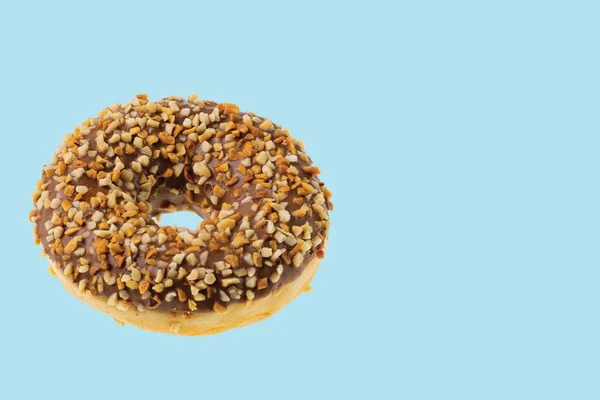 Close View Chocolate Donut Sprinkled Nuts Isolated Blue Background Sweden — ストック写真