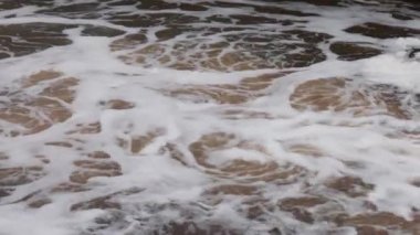 Close up view of cascade of flowing river with fast flow in centrum Uppsala. Sweden