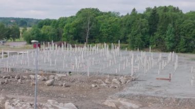View of construction industrial area with concrete piles driven into ground. Sweden. Enkoping. 08.05.2022