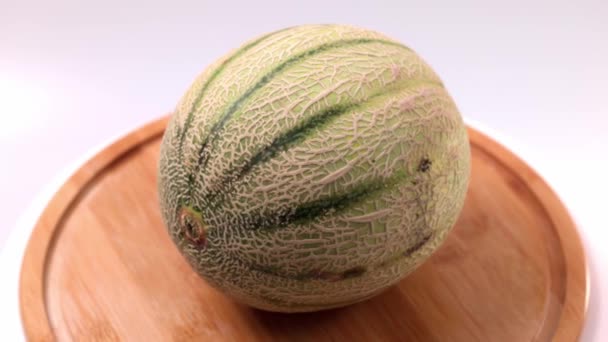 View Cantaloupe Melon Wooden Cutting Board Isolated — Stock video