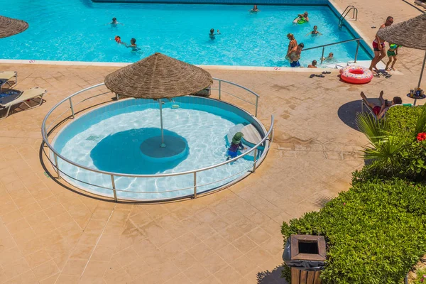 Beautiful View Empty Outdoor Pool Sun Umbrella Middle Babies Greece — Stockfoto