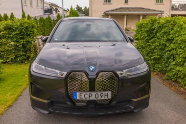 Beautiful front view of BMW IX40 black car electric model. Sweden. Uppsala. 08.18.2022.