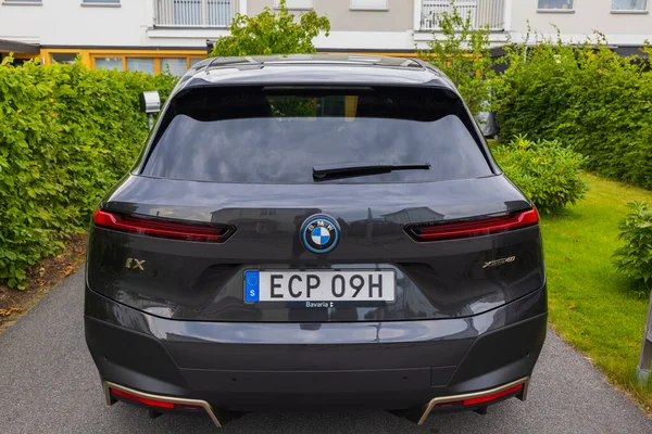 Beautiful back view of BMW IX40 black car electric model. Sweden. Uppsala. 08.18.2022.