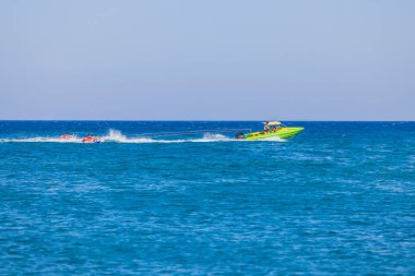 Beautiful view of sea activities for tourists. Blue sea water surface and blue sky background. 