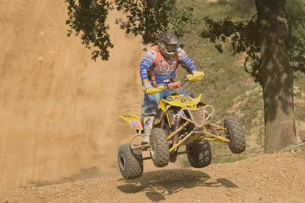 Young rider jumps the quad — Stock Photo, Image