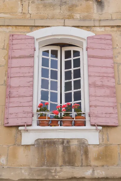 Traditional French window with pink shutters — Stock Photo, Image