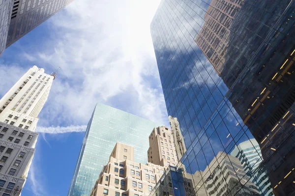 Skyscrapers with clouds reflection — Stock Photo, Image