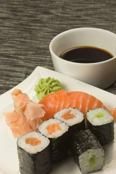 Sushi on a plate. Vertically. — Stock Photo, Image