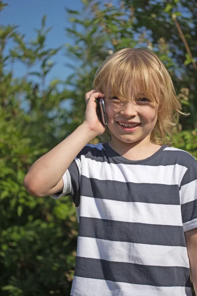 Laughing blond boy is calling outdoors — Stock Photo, Image