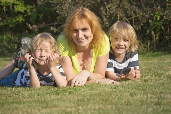 Mother with her sons outdoor — Stock Photo, Image