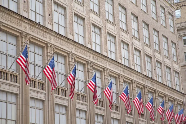 Old building with American flags — Stock Photo, Image
