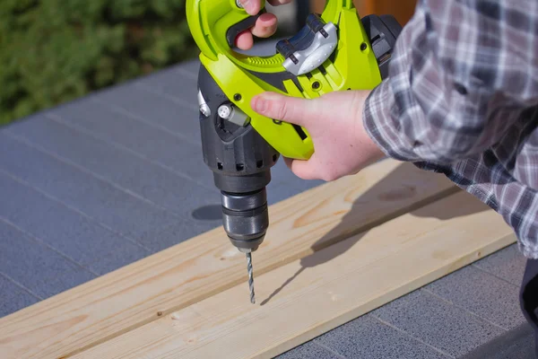 Handyman with a drill — Stock Photo, Image