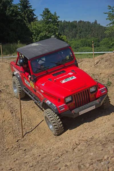 Red offroad car on the trial race — Stock Photo, Image