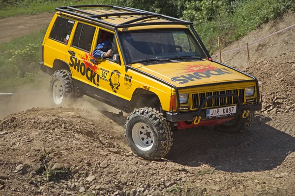 Yellow offroad car on the trial race — Stock Photo, Image