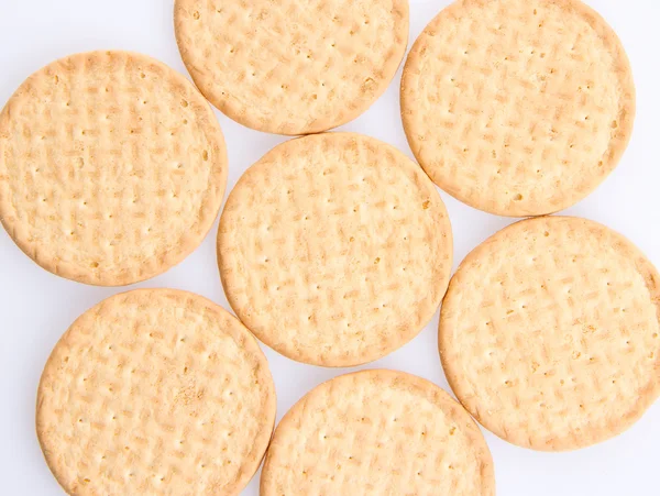 Alguns biscoitos redondos em um fundo cinza — Fotografia de Stock