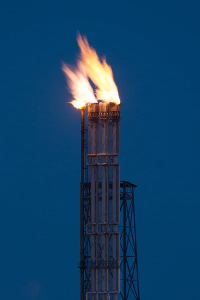 Burning oil gas flare during the night — Stock Photo, Image