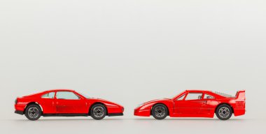 Two toy cars, red sportscars, room for text clipart