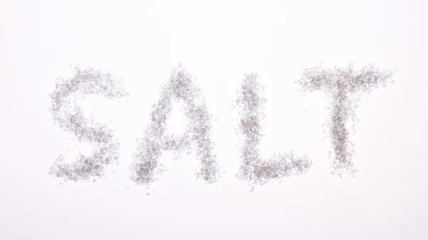 Das Wort Salz buchstabiert auf grauem Hintergrund — Stockfoto