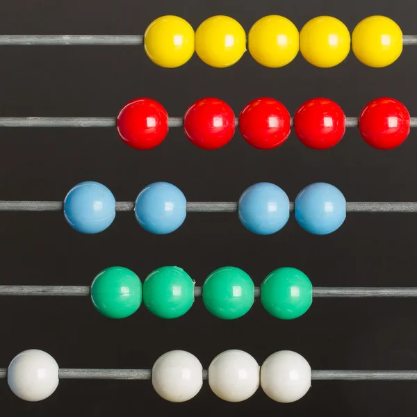 Close-up of an abacus on a grey background — Stock Photo, Image