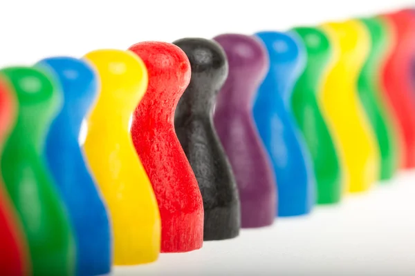 Colorful row of pawns — Stock Photo, Image