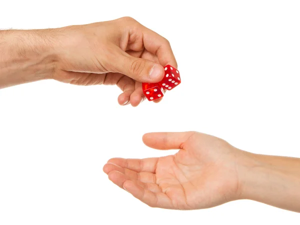 Two red dice being given — Stockfoto