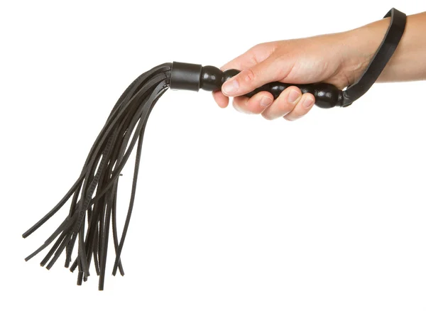 Strict Black Leather Flogging Whip in woman's hand — Stock Photo, Image