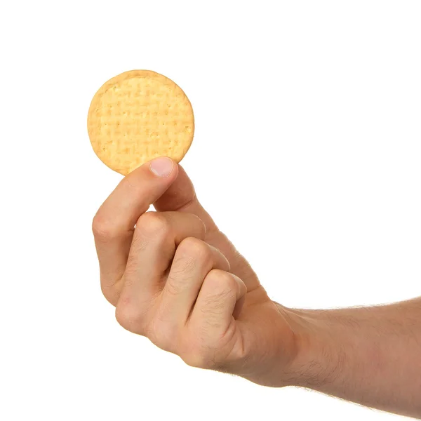 Άνθρωπος με ένα μπισκότο στο χέρι του — Φωτογραφία Αρχείου