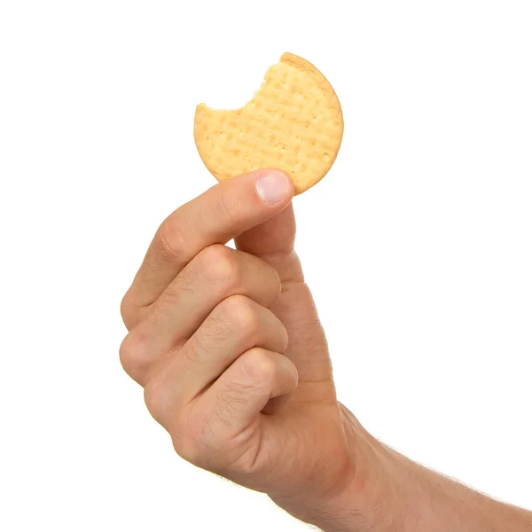 Homem com um biscoito na mão — Fotografia de Stock