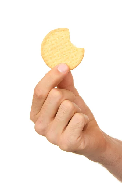 Homem com um biscoito na mão — Fotografia de Stock