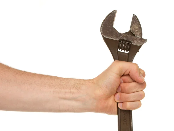 Old rusted adjustable wrench in a hand — Stok fotoğraf