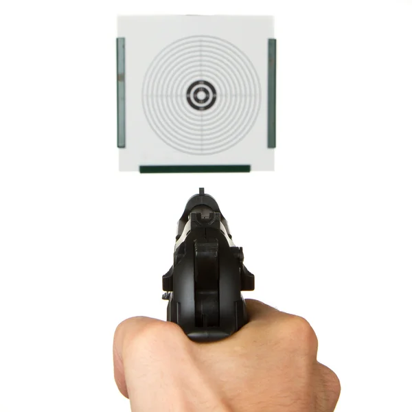 Handgun aimed on a shooting target — Stock Photo, Image