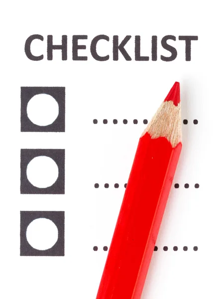 Red pencil on a checklist — 图库照片