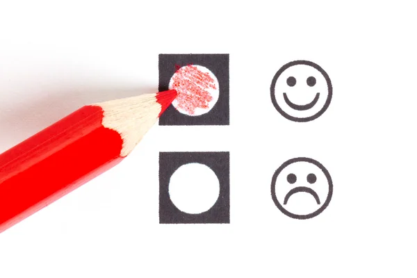 Red pencil choosing the right smiley — ストック写真