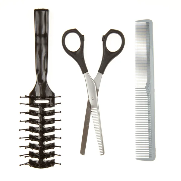 Cutting scissors or shears and black comb and a black brush — Stock Photo, Image