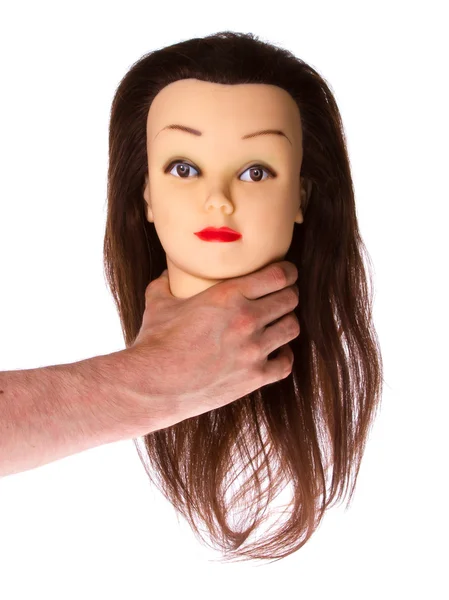 Рука держит куклу (укладка волос) ) — стоковое фото