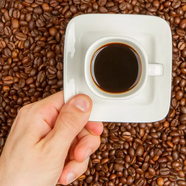 Cup of coffee on beans. top view — Stock Photo, Image