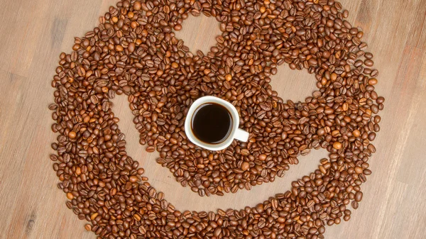 Coffee grains arranged in smiley — Stock Photo, Image