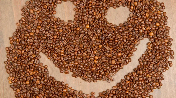 Coffee grains arranged in smiley — Stock Photo, Image