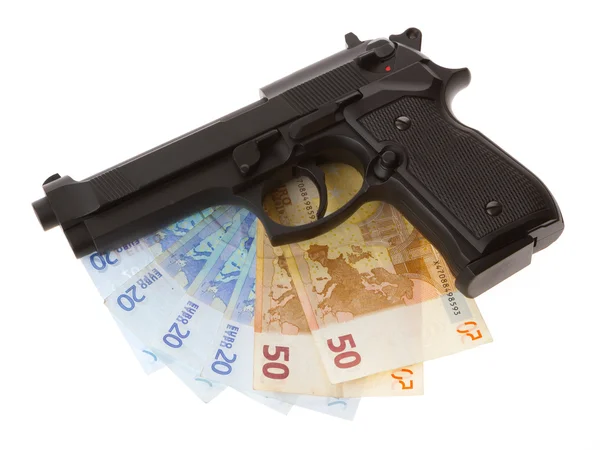 Pistola semiautomática y dinero aislado — Foto de Stock